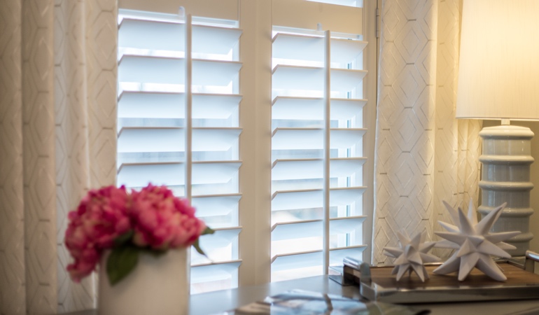 Plantation shutters by flowers in Indianapolis
